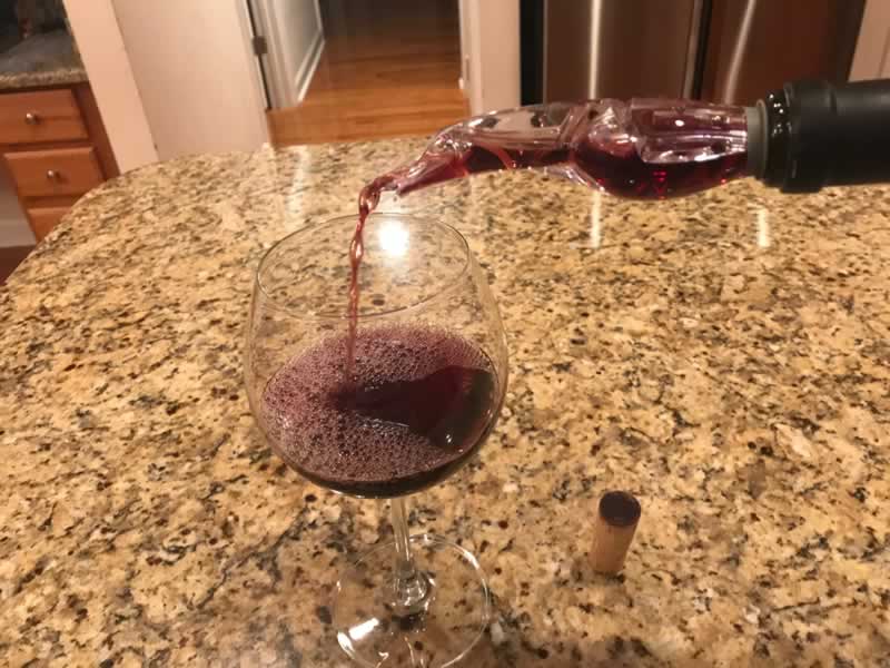 Pouring a glass of The Thomas George Estates Pinot Noir 2012