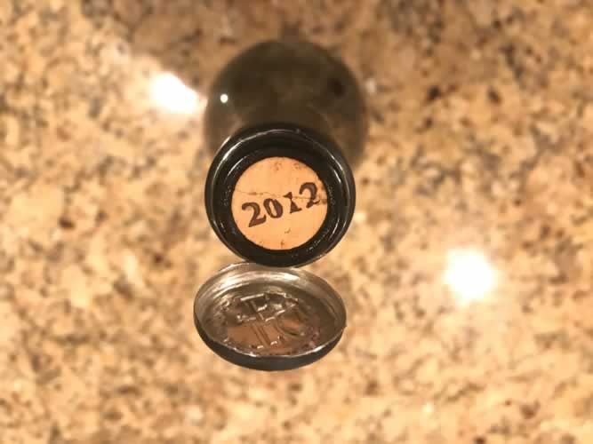 The Thomas George Estates Pinot Noir cork with 2012 printed on it.